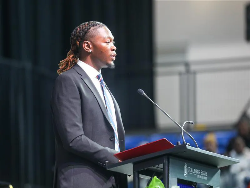 A student giving a speech for the student body at a CSU event