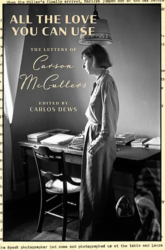 Cover of All the Love You Can Use: The Letters of Carson McCullers, edited by Carlos Dews, showing McCullers standing at a desk with a typewriter.