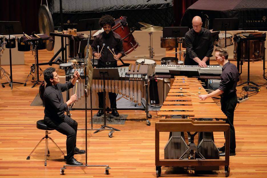 People playing Percussion Instruments