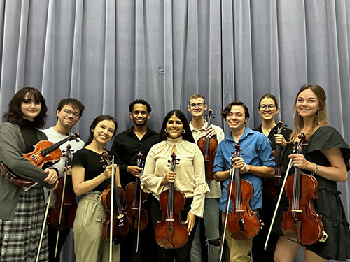 a group of students posing with violas