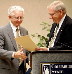 President Frank Brown receives a proclamation from Mayor Jim Wetherington recognizing CSU's 50th anniversary at a Jan. 24, 2008 kickoff event