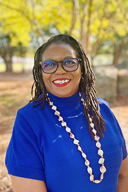 headshot of Tess Aina