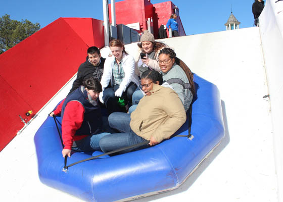 Three students on a slide at the Snow Mountain water park
