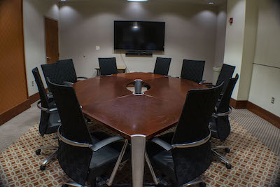 10-person conference desk, tv on the wall